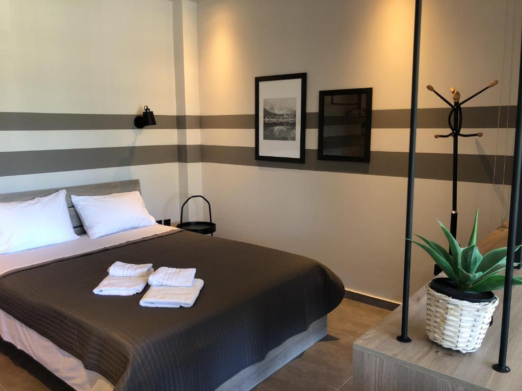 Postel nebo postele na pokoji v ubytování siviri suites