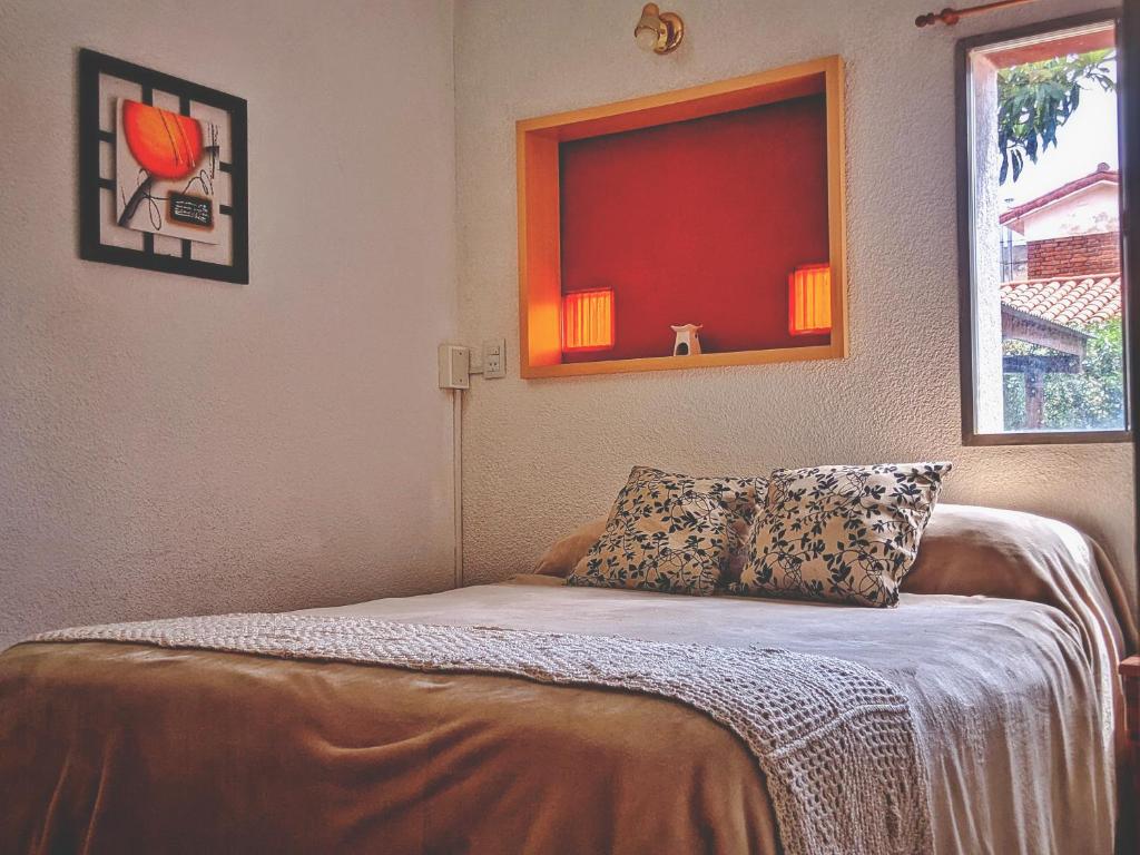 Кровать или кровати в номере HERMOSO ALOJAMIENTO TEMPORARIO KAYA