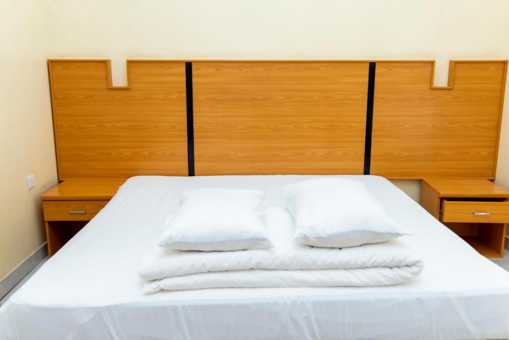 Postel nebo postele na pokoji v ubytování Al Ghaba Line Hotel