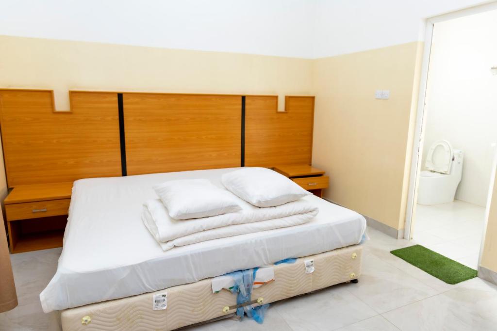 Postel nebo postele na pokoji v ubytování Al Ghaba Line Hotel
