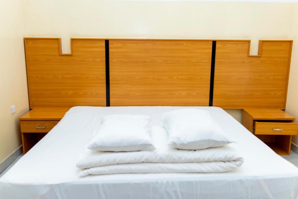 Postel nebo postele na pokoji v ubytování Al Ghaba Line Hotel