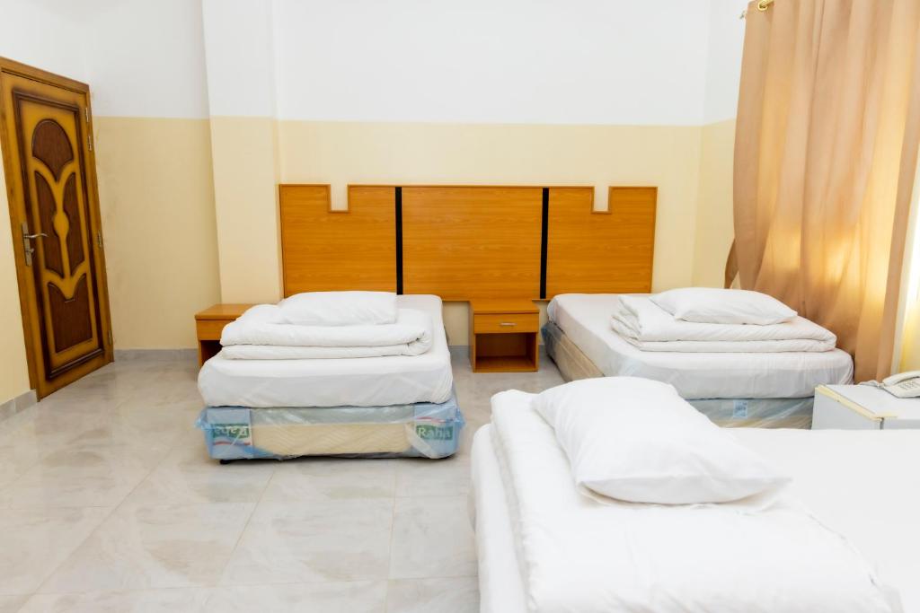 Postel nebo postele na pokoji v ubytování Al Ghaba Line Hotel