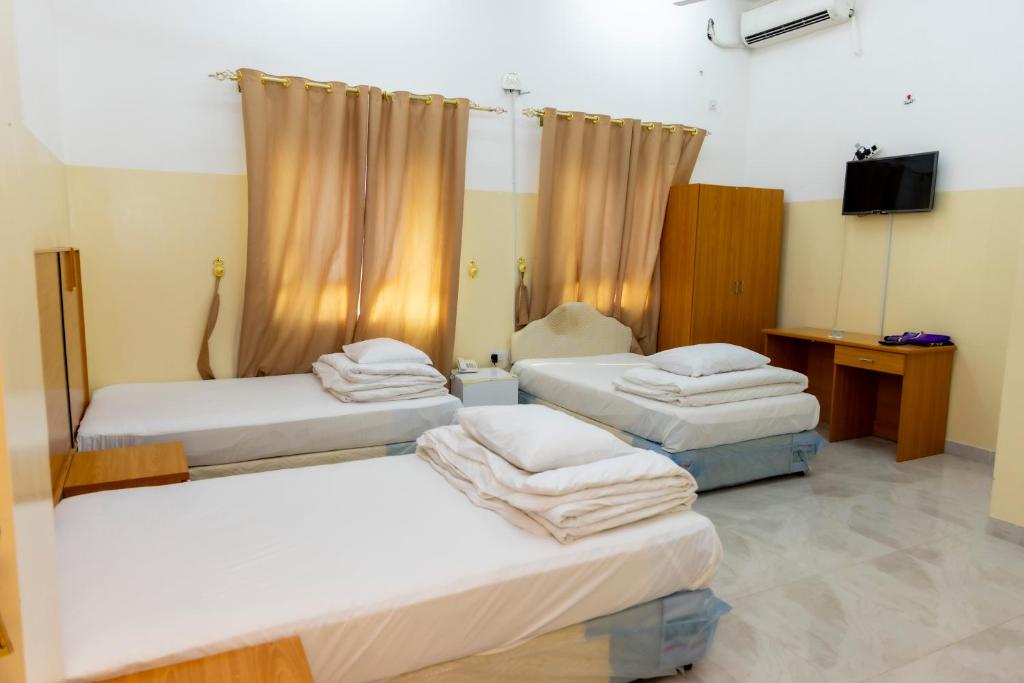 Postel nebo postele na pokoji v ubytování Al Ghaba Line Hotel