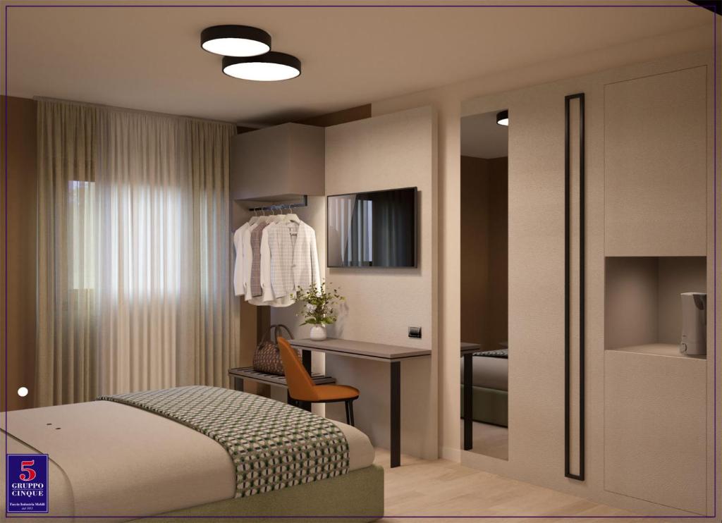 Postel nebo postele na pokoji v ubytování Hotel San Carlo