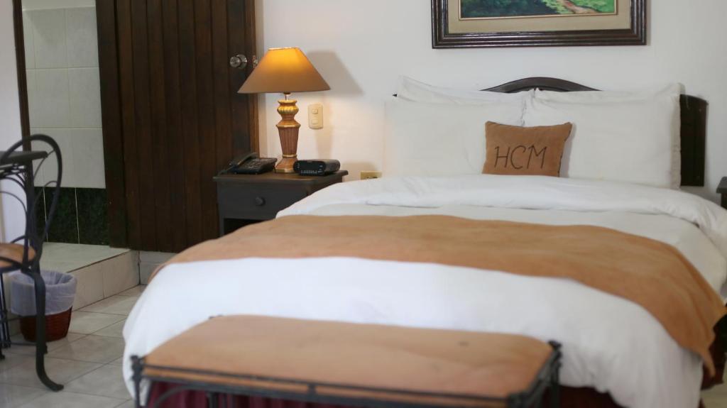 Postel nebo postele na pokoji v ubytování Hotel Camino Maya