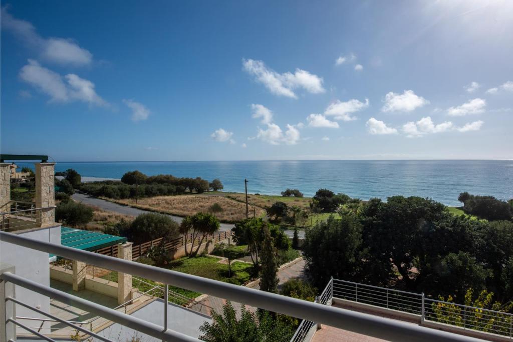 a view of the ocean from a balcony at Portela Apartments Kampoula in Keratokampos