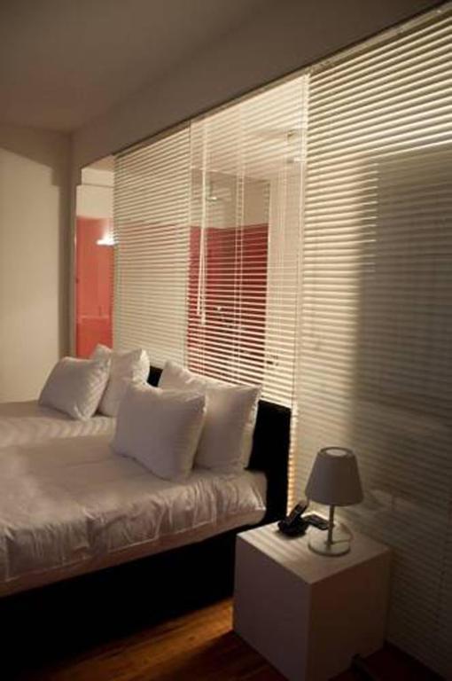 Postel nebo postele na pokoji v ubytování Sarroglia Hotel