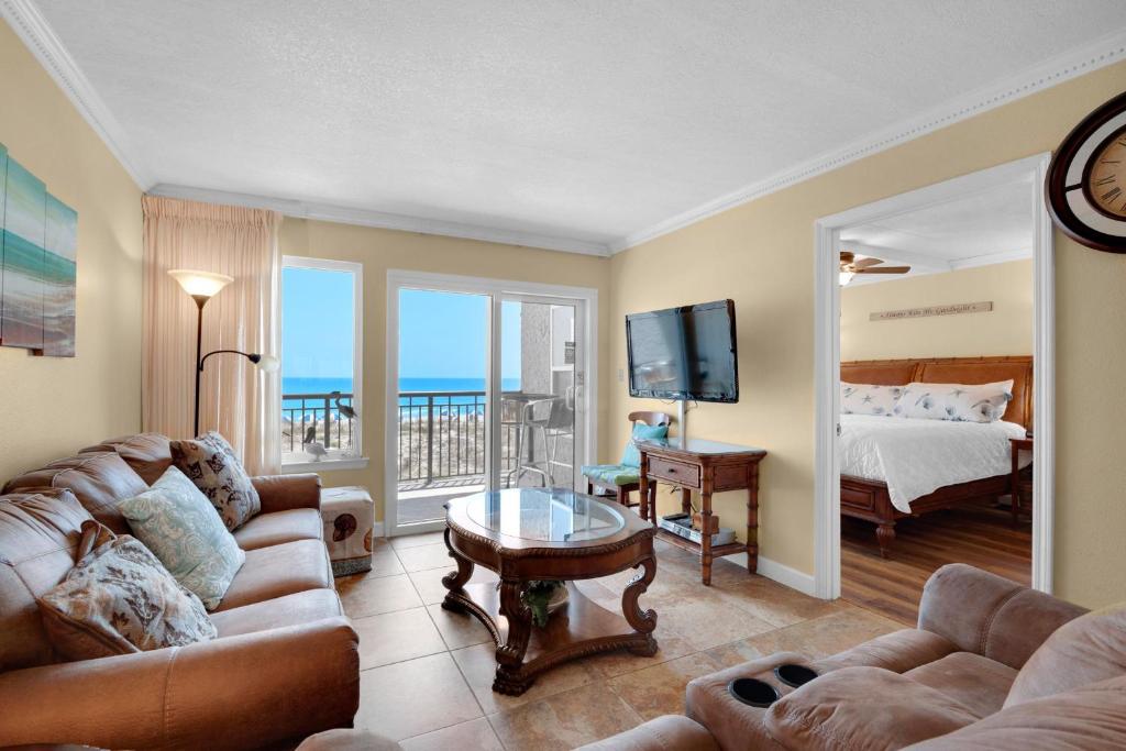 a living room with a couch and a bed at Island Echos #2E in Fort Walton Beach