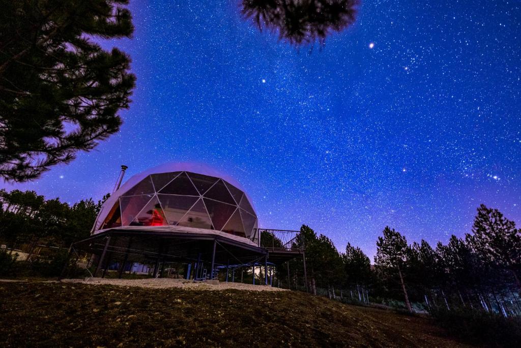 a observatory under a starry sky at night at Continental Adventure Resort - Mountain Escape & Glamping in Livno