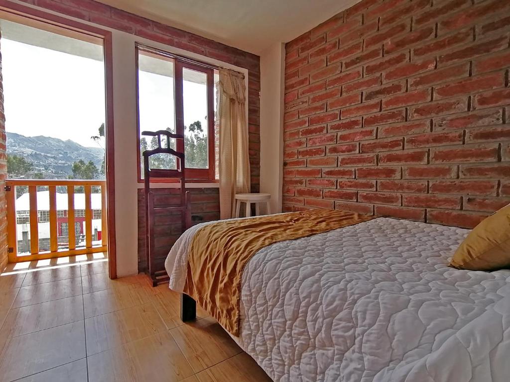 Postel nebo postele na pokoji v ubytování Lagoon Hotel Chugchilan