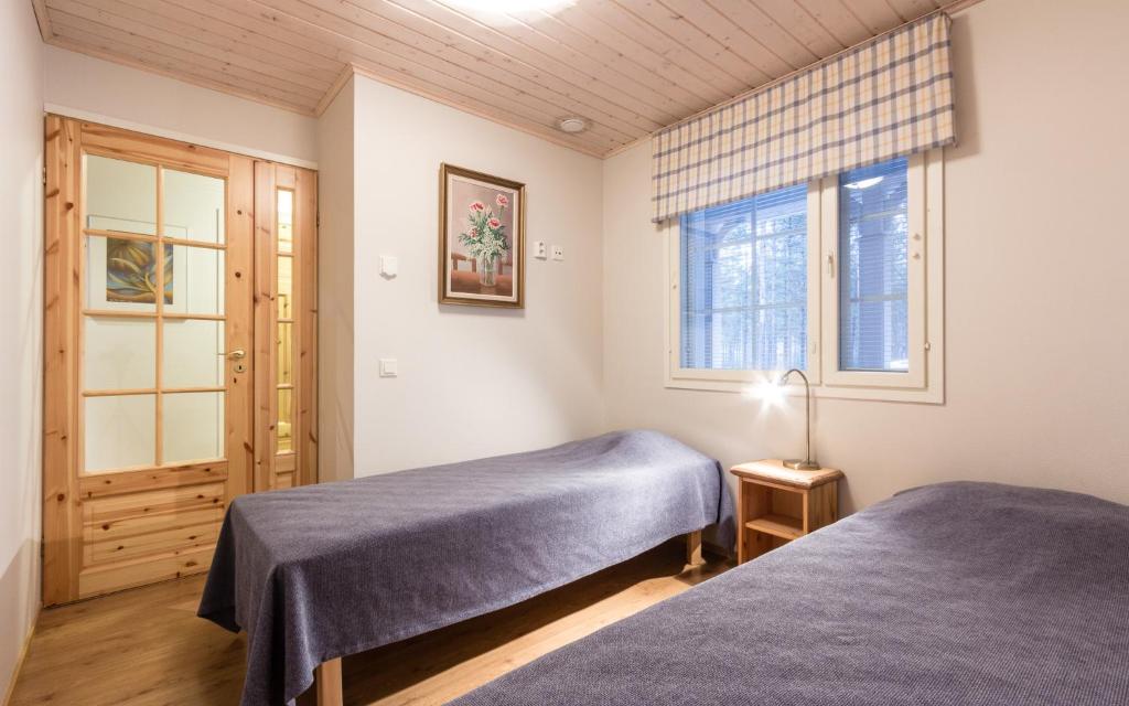 Postel nebo postele na pokoji v ubytování Tapion Tupa