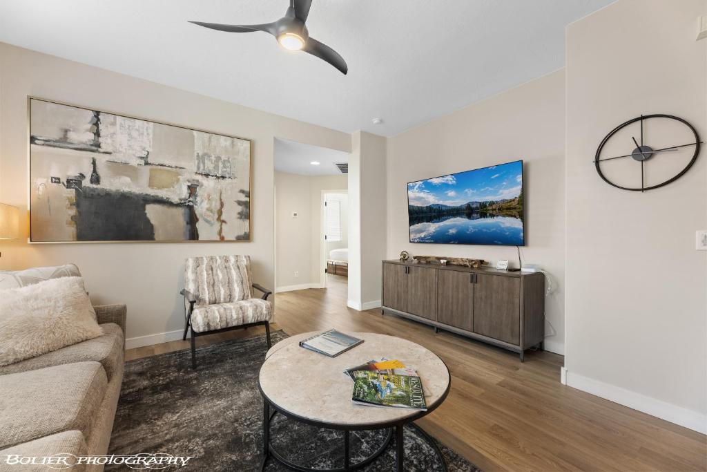 a living room with a couch and a table at Beautiful Condo at the Springs By Cool Properties in Mesquite
