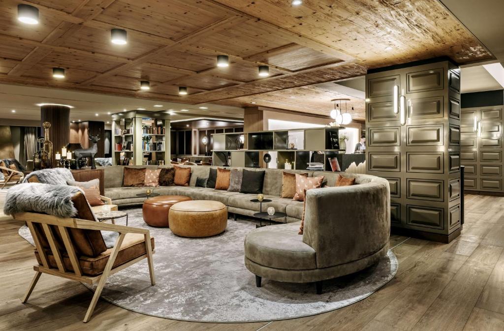 a large living room with couches and chairs at Grand Tirolia Kitzbühel - Member of Hommage Luxury Hotels Collection in Kitzbühel