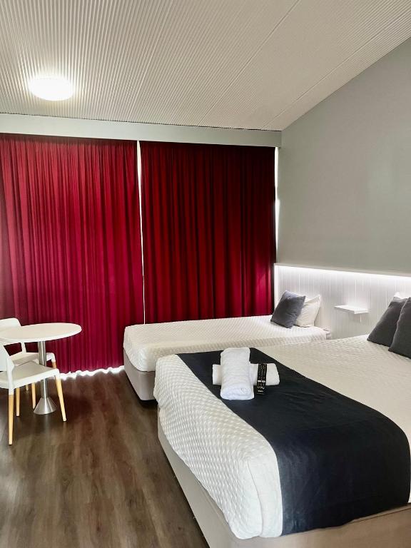 Postel nebo postele na pokoji v ubytování Banana Hotel Motel