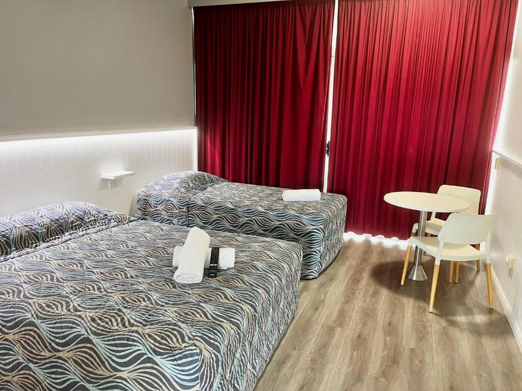 Postel nebo postele na pokoji v ubytování Banana Hotel Motel