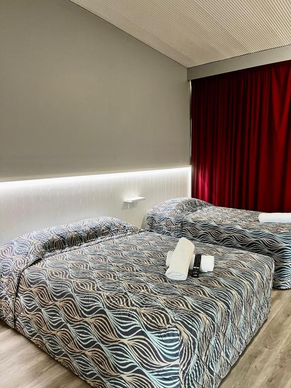 Postel nebo postele na pokoji v ubytování Banana Hotel Motel