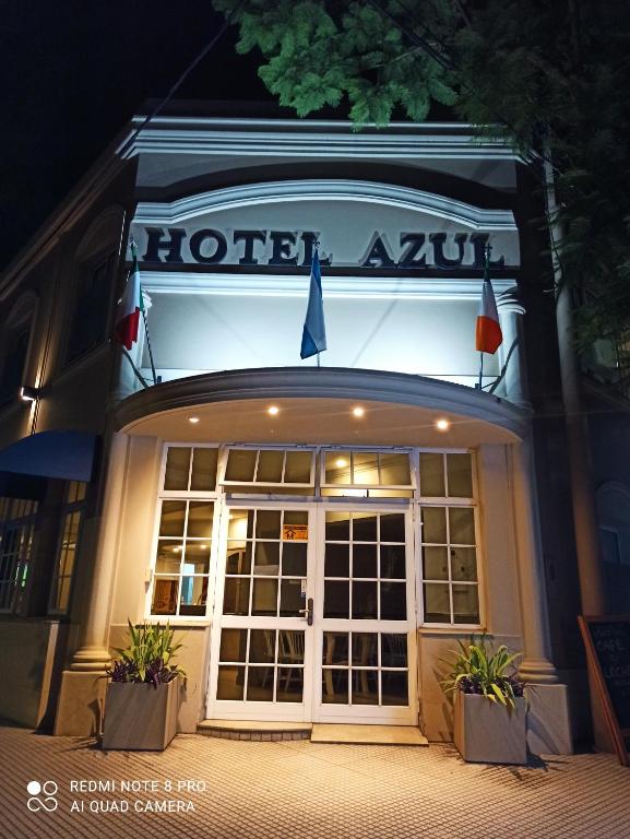 a front door of a hotel at night at Hotel Azul Junin in Junín