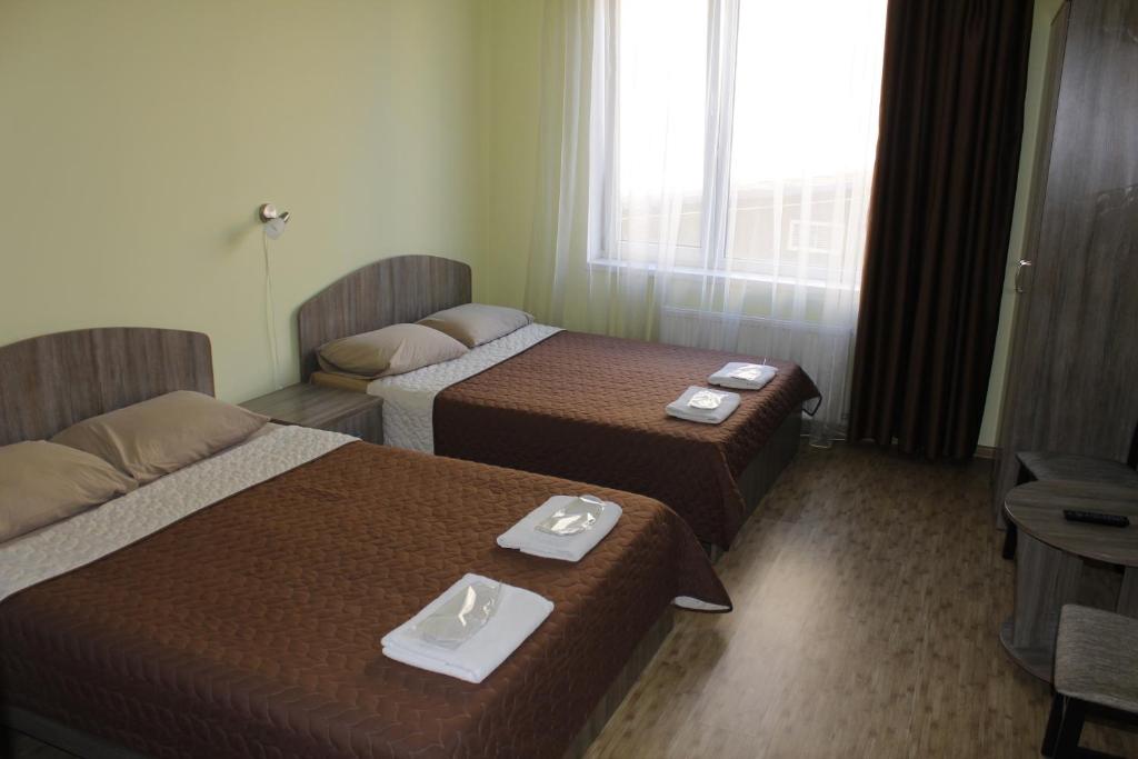 Postel nebo postele na pokoji v ubytování Arnautskiy Hotel
