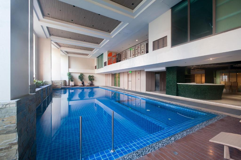 a large swimming pool in a building at KL Serviced Residences Managed by HII in Manila