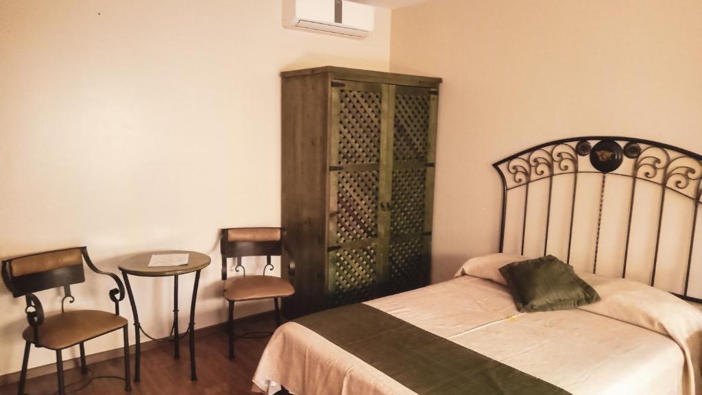 Postel nebo postele na pokoji v ubytování HOTEL PLAZA PACHUCA
