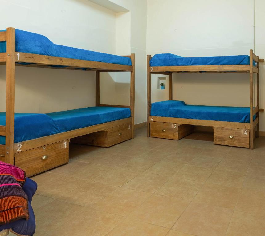 Postel nebo postele na pokoji v ubytování HOSTEL PUNTO RAMIREZ
