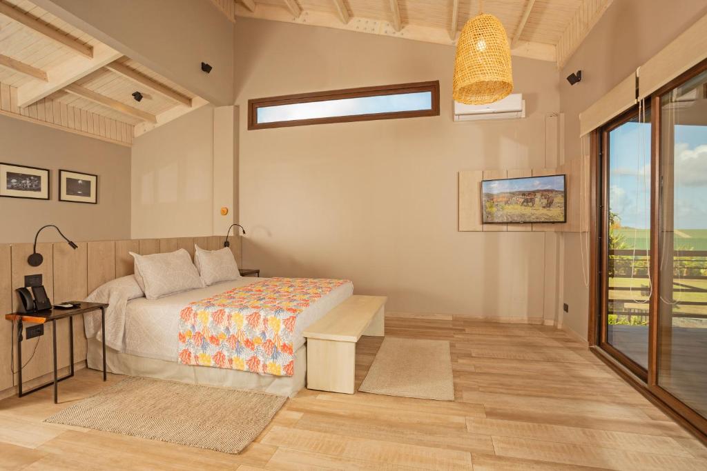 Postel nebo postele na pokoji v ubytování Hotel Ohana Rapa Nui