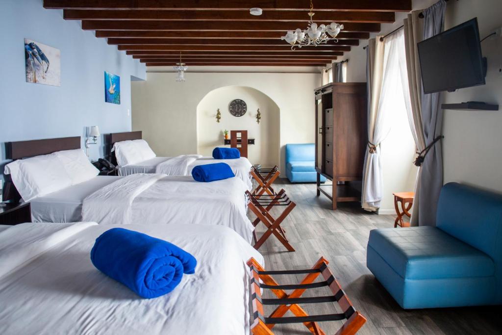 Postel nebo postele na pokoji v ubytování Hotel Colonial San Agustin