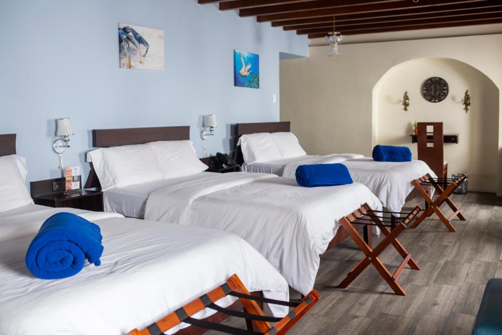 Postel nebo postele na pokoji v ubytování Hotel Colonial San Agustin