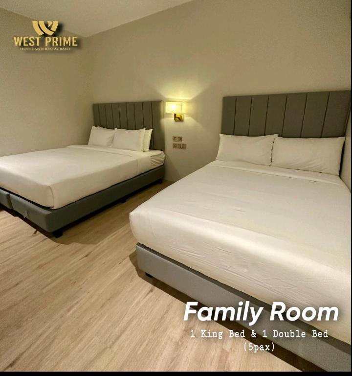 Postel nebo postele na pokoji v ubytování West Prime Hotel