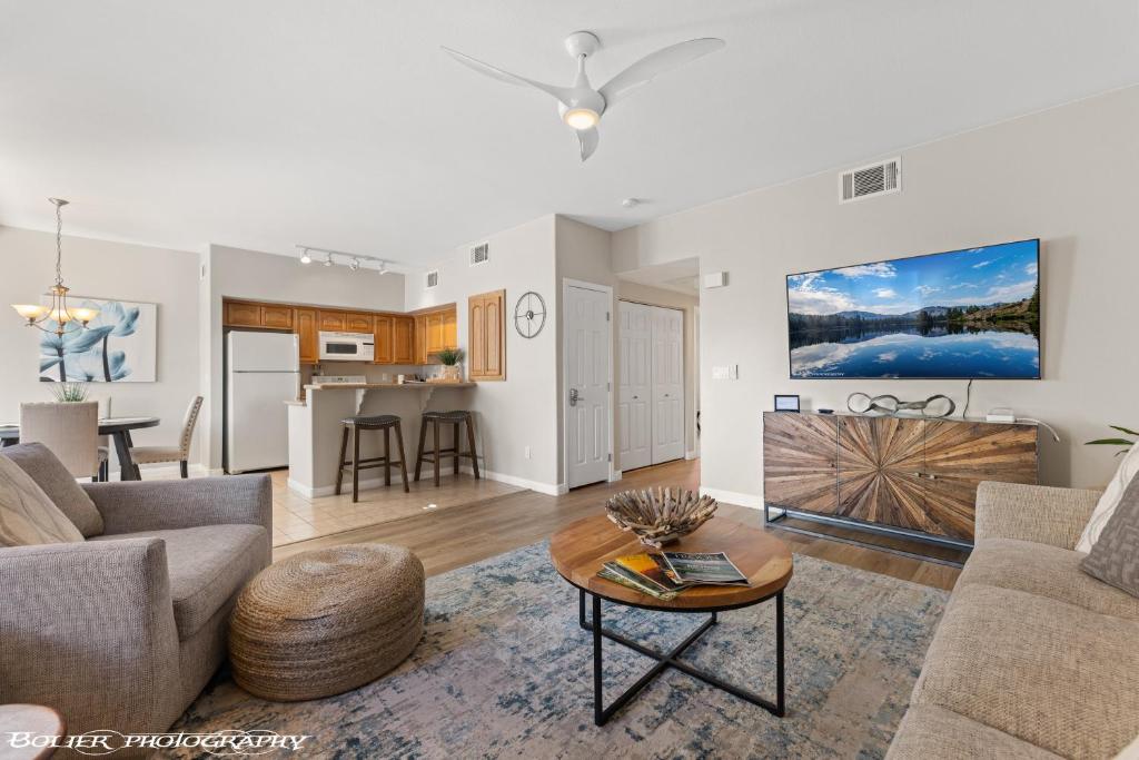 a living room with a couch and a table at Hawk Ridge Two Bedroom Condo by Cool Properties in Mesquite