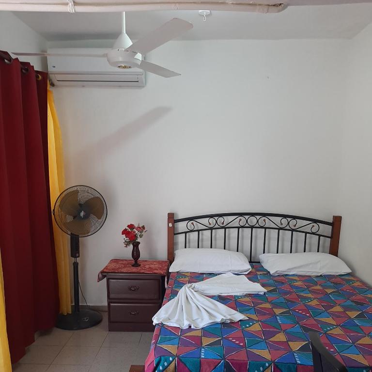 Postel nebo postele na pokoji v ubytování B&B KeisyAlba Punta Rucia