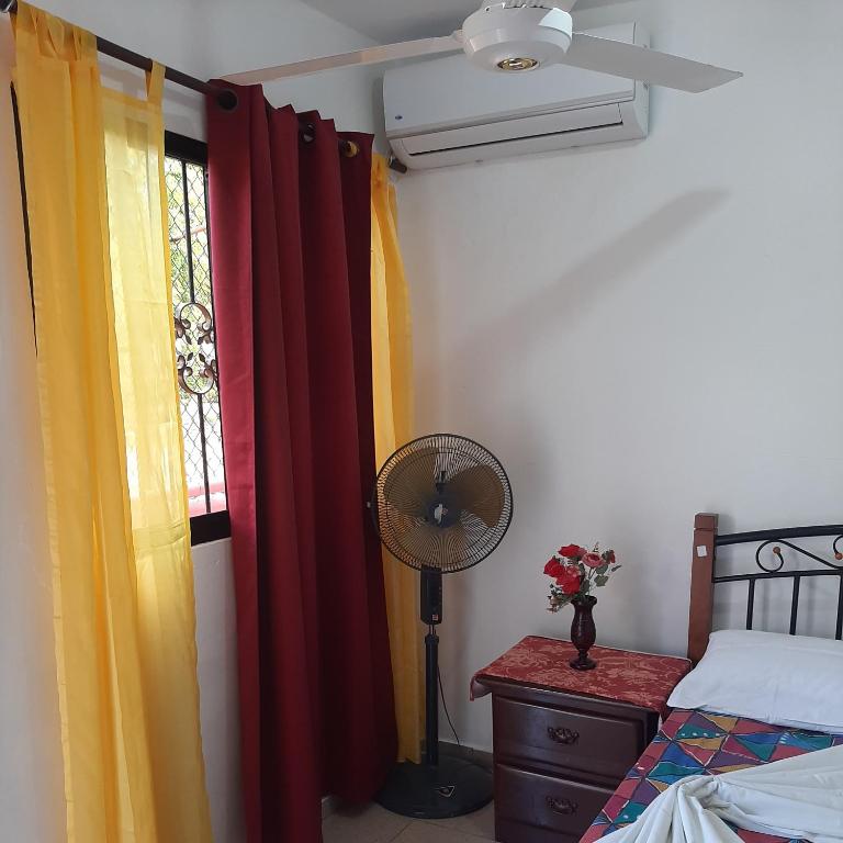 Postel nebo postele na pokoji v ubytování B&B KeisyAlba Punta Rucia