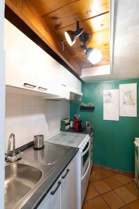 A kitchen or kitchenette at Via dei Cestari loft