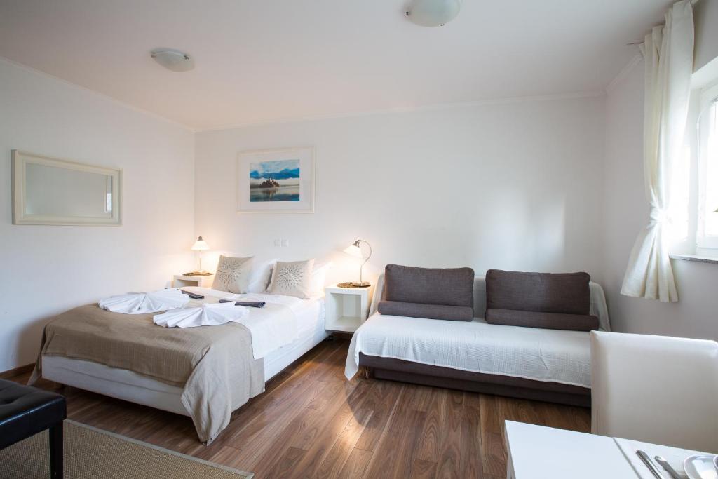 Postel nebo postele na pokoji v ubytování Bled Apartments