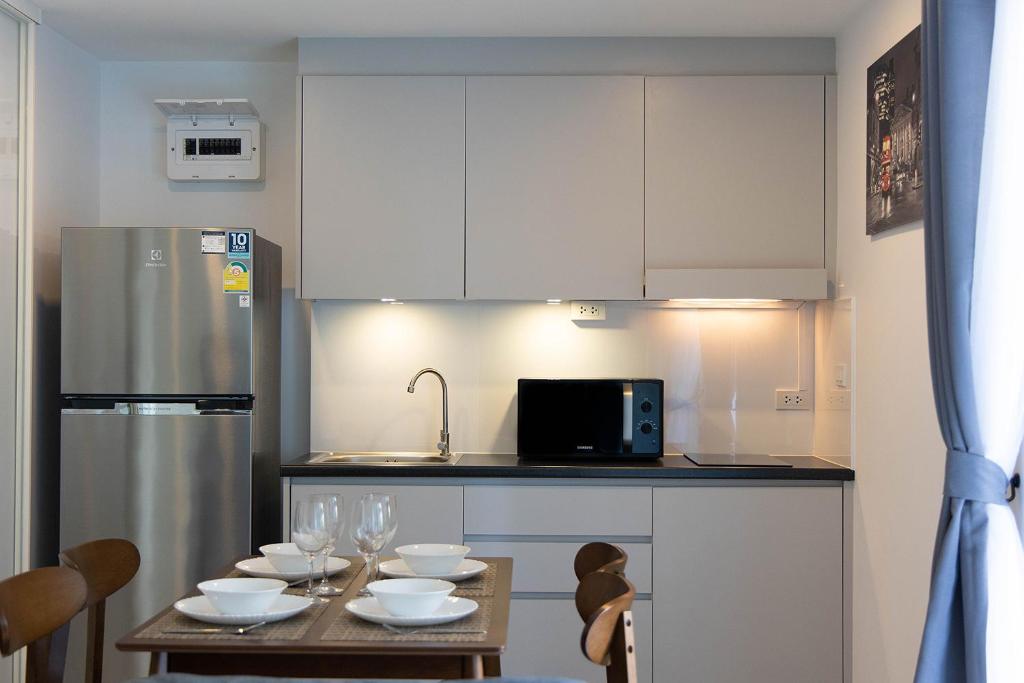 Kuchyň nebo kuchyňský kout v ubytování Mantra Beach condominium By AProperty