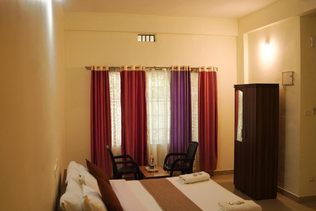 Letto o letti in una camera di Wayanad Royal Stream