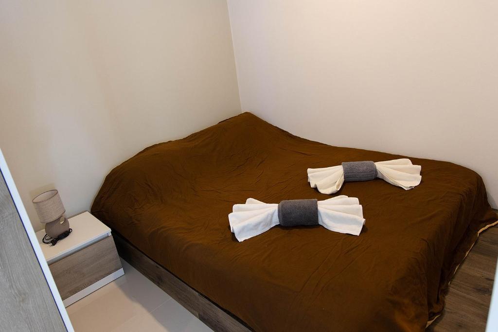Postel nebo postele na pokoji v ubytování Mantra Beach condominium By AProperty