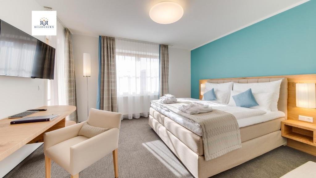 Postel nebo postele na pokoji v ubytování R&R Residenzen Aparthotel