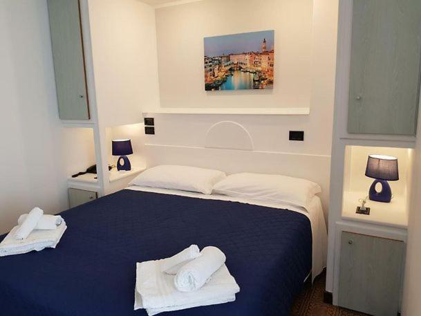 Postel nebo postele na pokoji v ubytování Hotel La Plancia