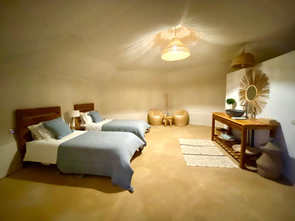 Postel nebo postele na pokoji v ubytování Tuda Luxury Camp