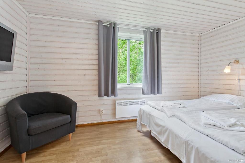 Postel nebo postele na pokoji v ubytování First Camp Nydala-Umeå