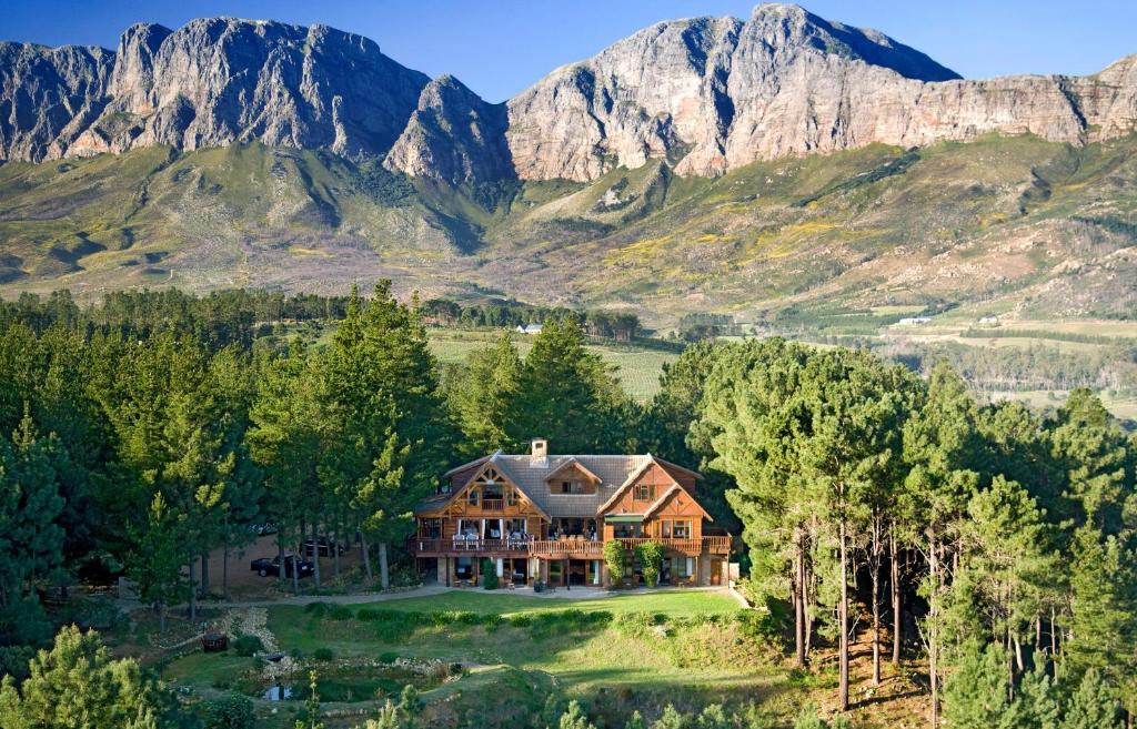 an aerial view of a house in the mountains at Lalapanzi Lodge in Somerset West