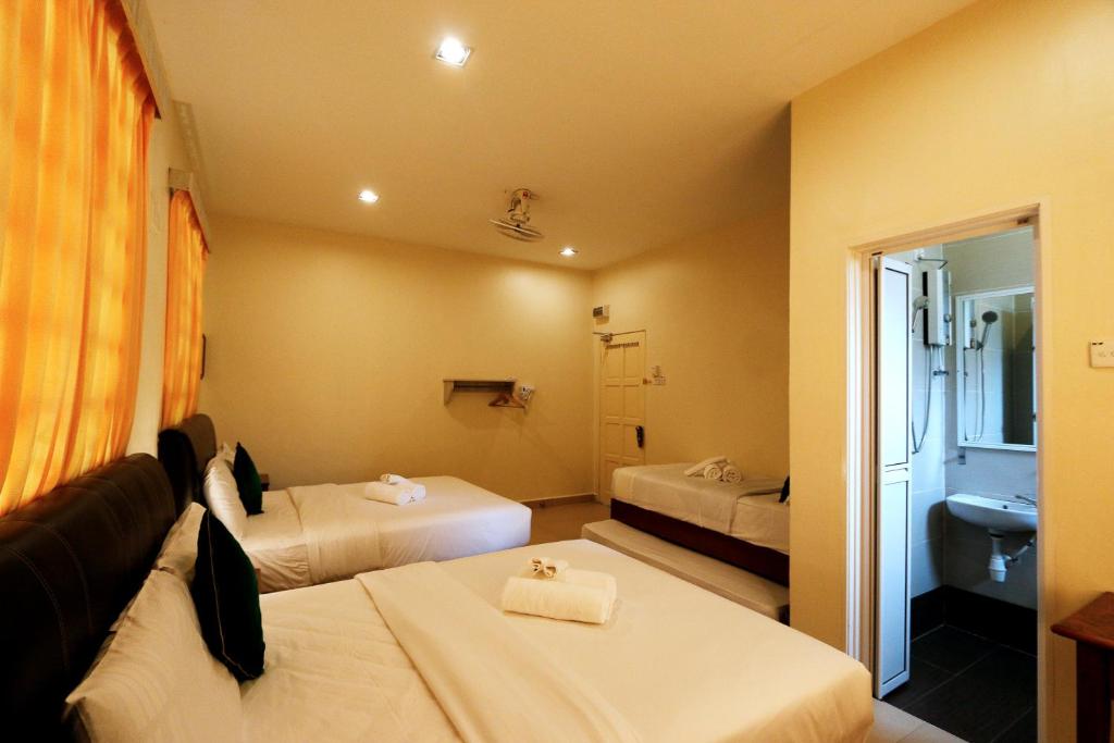Postel nebo postele na pokoji v ubytování Golden Lodge