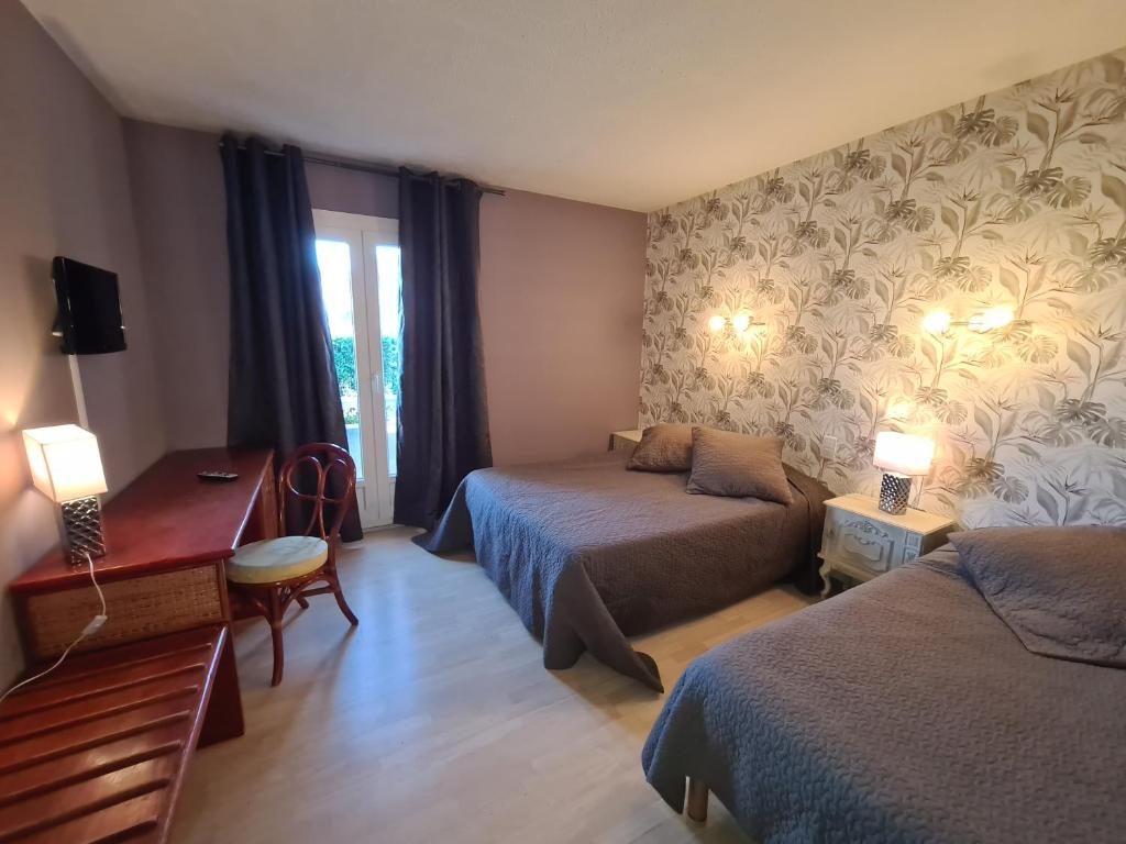 Postel nebo postele na pokoji v ubytování Hôtel Restaurant Le Mas De L'Olivier