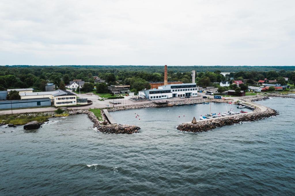 an aerial view of a body of water with people swimming at Viinistu Art Hotel in Viinistu