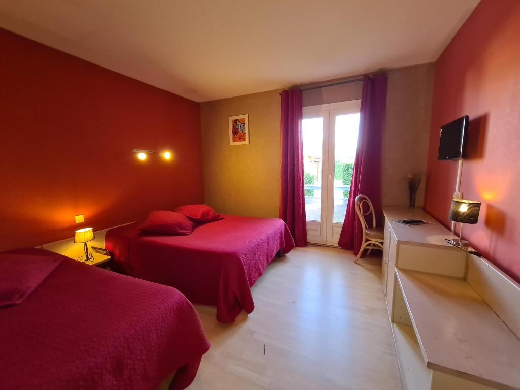 Postel nebo postele na pokoji v ubytování Hôtel Restaurant Le Mas De L'Olivier