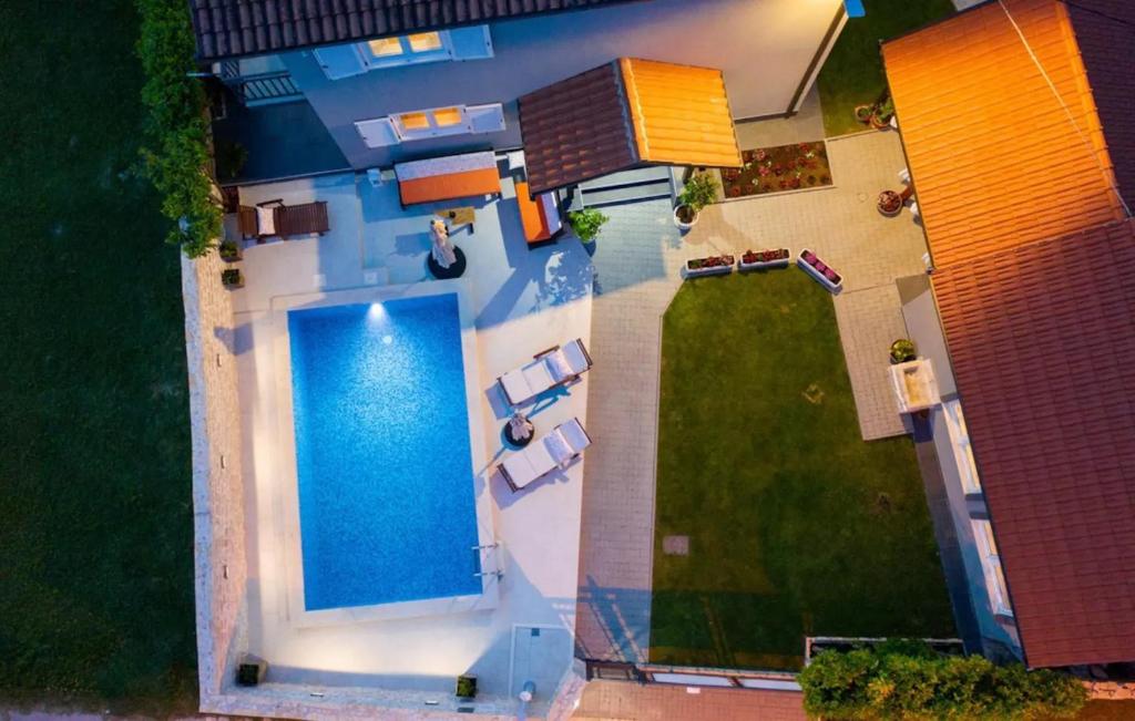 an overhead view of a house with a swimming pool at Villa Sierra in Sinj