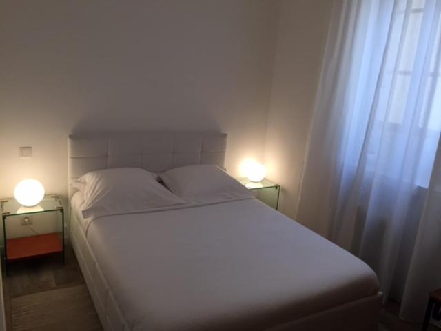 Postel nebo postele na pokoji v ubytování Maison Palm Beach à Cannes