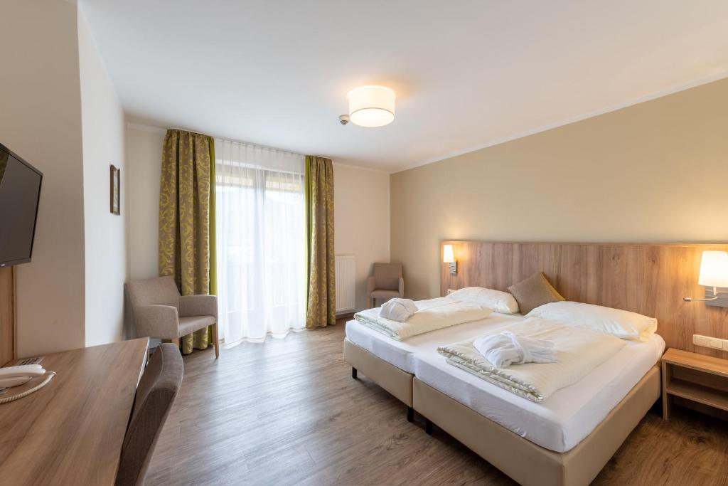 Postel nebo postele na pokoji v ubytování Hotel Marko