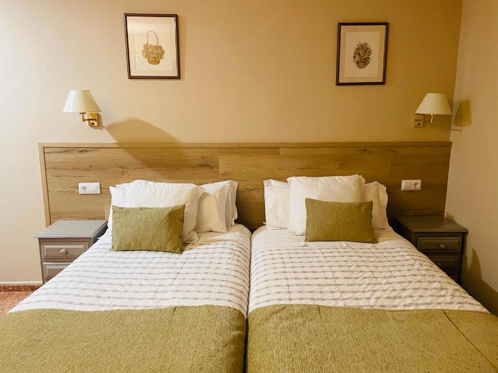 Postel nebo postele na pokoji v ubytování Hostal Escuils